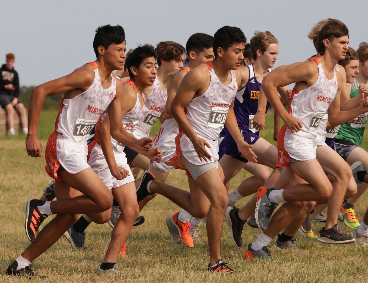 The Mineola boys cross country team strides out at the start of the Lindale Invitational. (Monitor photos by John Arbter)